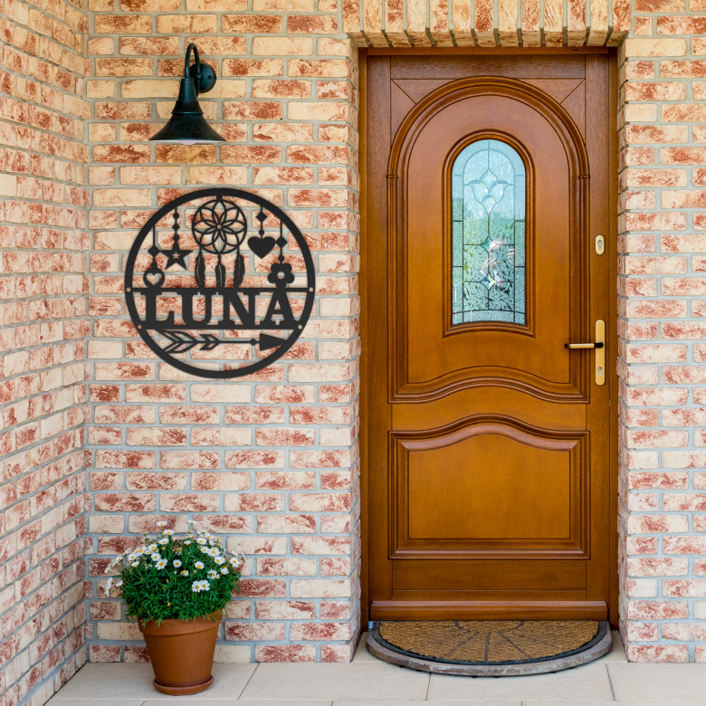 Dreamcatcher_Name_Metal_Sign_Black_Brick_Entrance_Mockup.png