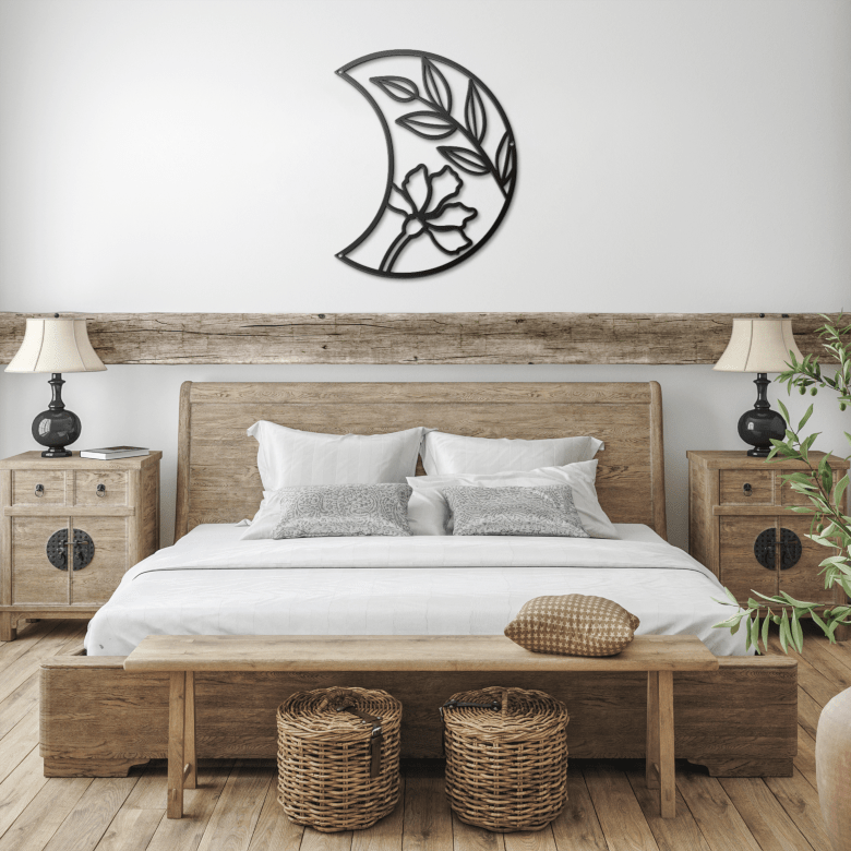 Black Half Moon Floral Metal Wall Art above a rustic farmhouse bed — bringing grounded lunar beauty into a cozy, bohemian bedroom sanctuary.