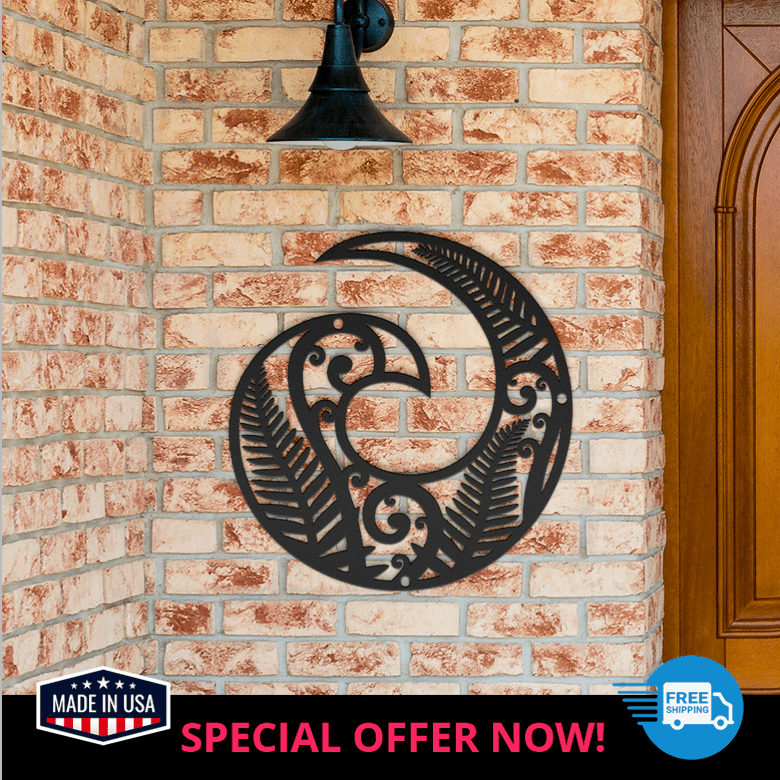 Modern black Koru spiral wall art displayed at front door brick wall