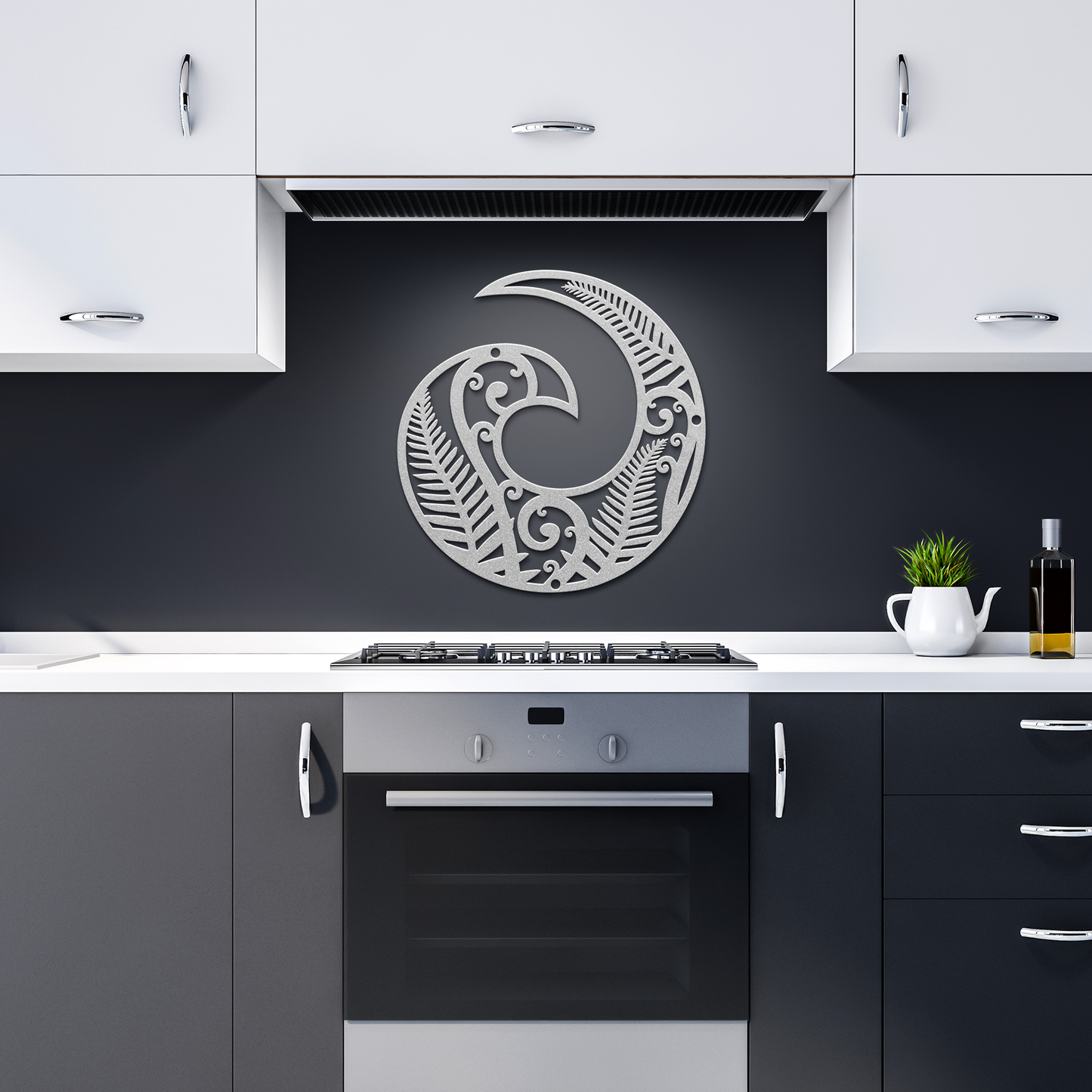 Silver Koru symbol decor in modern dark kitchen setting