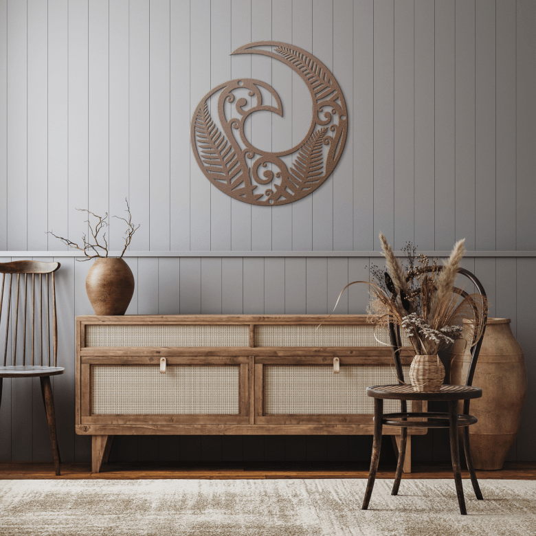 Copper Koru metal wall art mounted in a cozy rustic hallway